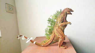 Illustration for article titled Godzilla Made from Pine Tree Branches Is a Lovely Fire Hazard